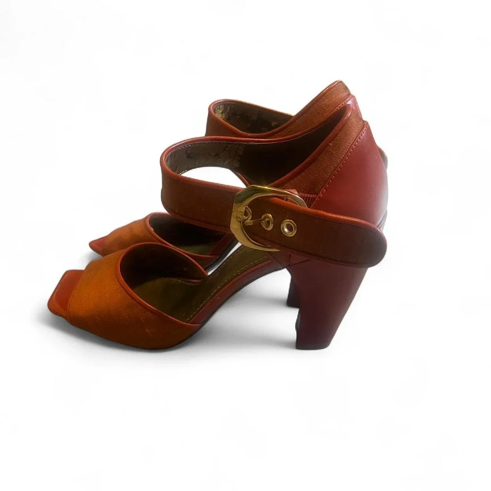 Paleo orange leather heels with gold buckle
